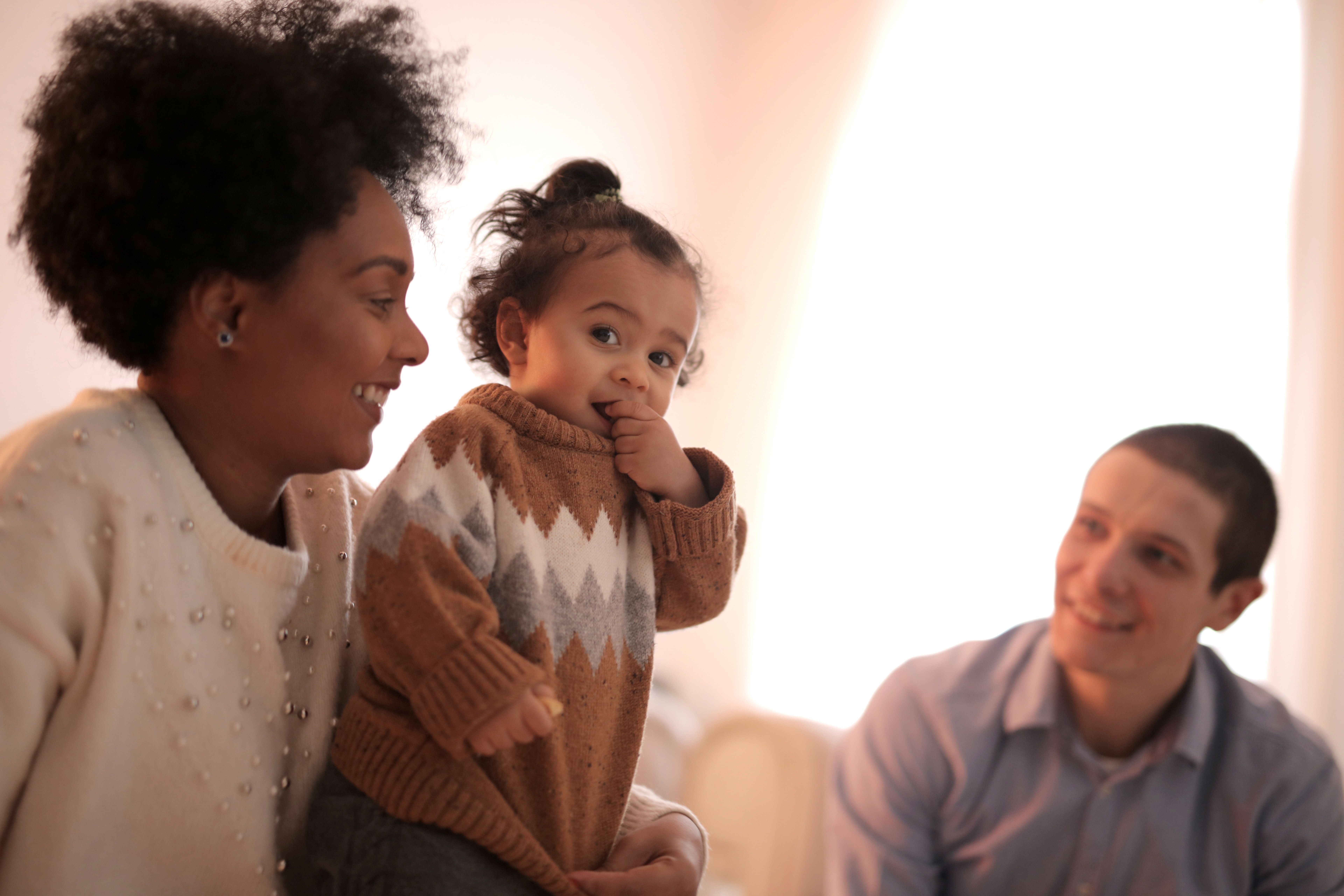 Family relaxed together at home, the everyday setting a home defense plan is built around.